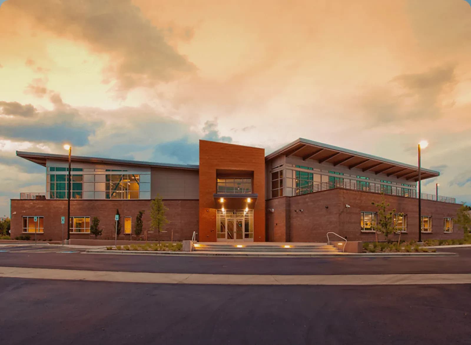 Modern brick office building at sunset